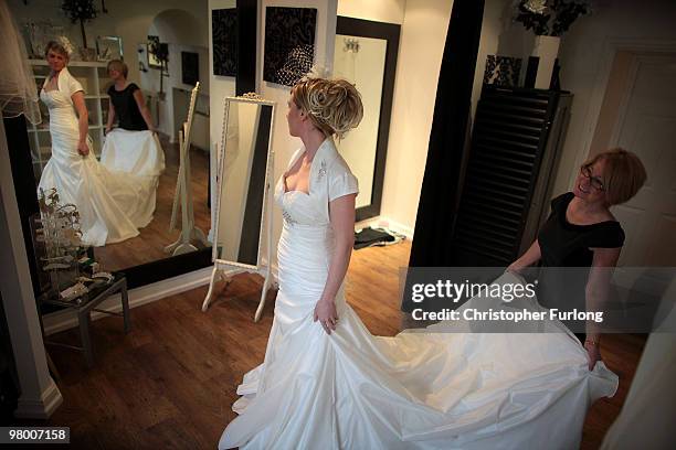 Bride to be Vicki Blaney tries on a wedding dress for size at I Do Bridal Designs in Cockermouth High Street on March 24, 2010 in Cockermouth,...