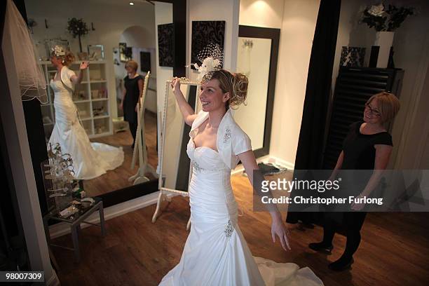 Bride to be Vicki Blaney tries on a wedding dress for size at I Do Bridal Designs in Cockermouth High Street on March 24, 2010 in Cockermouth,...