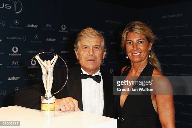 World champion Grand Prix motorcycle road racer Giacomo Agostini and guest arrive at the Laureus World Sports Awards 2010 at Emirates Palace Hotel on...