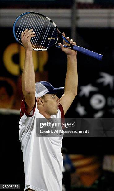 United States' Andy Roddick competes against Sweden's Thomas Enqvist during a Davis Cup quarterfinal match in Delray Beach, Florida April 9, 2004....