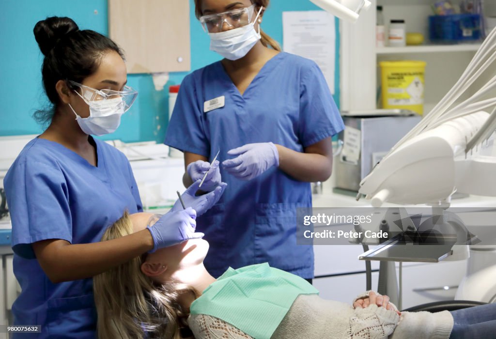 Dentist working on patient in chair