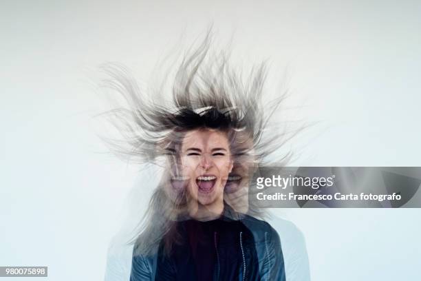 double identity - woman wind in hair stock pictures, royalty-free photos & images