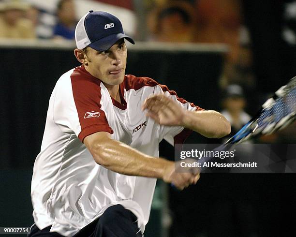 United States' Andy Roddick competes against Sweden's Thomas Enqvist during a Davis Cup quarterfinal match in Delray Beach, Florida April 9, 2004....