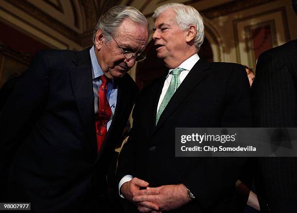 Sen. Tom Harkin and Senate Banking and Urban Affairs Committee Chairman Christopher Dodd talk during a rally and news conference about the benefits...