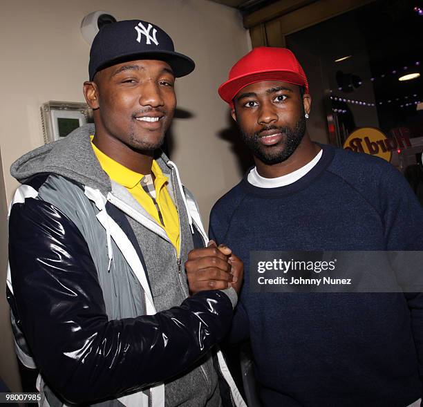 Players Shaun Phillips and Darrelle Revis film an Earth Day E campaign in Times Square on March 23, 2010 in New York City.