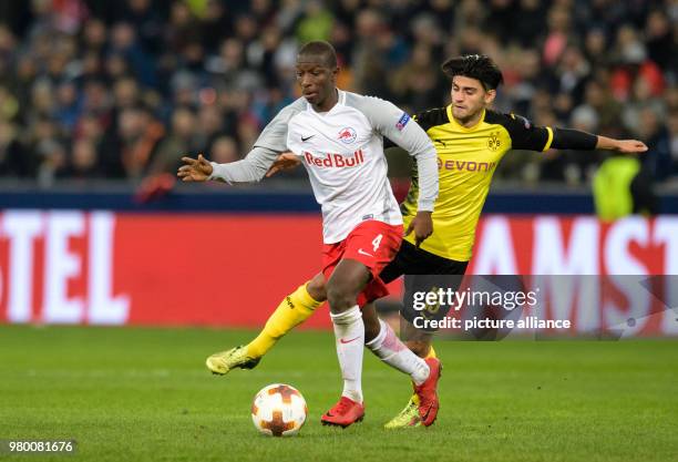 Dortmund's Mahmoud Dahoud and Salzburg's Amadou Haidara vie for the ball during the UEFA Europa League round of 16 second leg soccer match between FC...