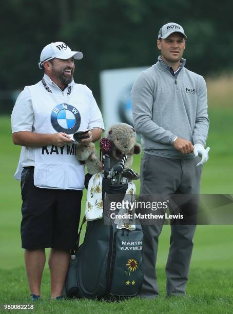 Martin Kaymer of Germany looks on with his caddie Craig Connelly during day one of the BMW International Open at Golf Club Gut Larchenhof on June 21,...