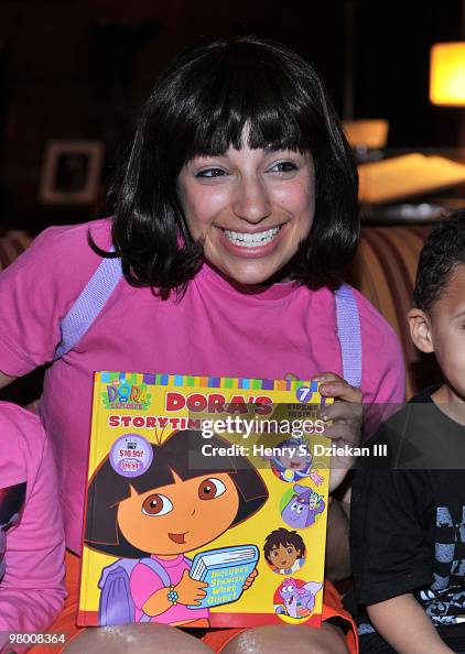 Dora Reeves A person portraying Dora the Explorer attends a story time live event ...