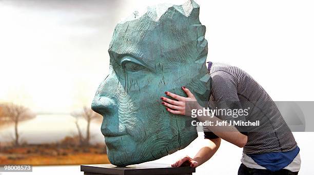 An exhibitor views a sculpture at Glasgow Art Fair on March 24, 2010 in Glasgow, Scotland. Held in George Square in the heart of the city this...