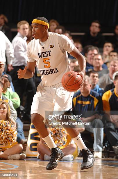 Kevin Jones of the West Virginia Mountaineers dribbles the ball during the Big East Quarterfinal College Basketball Championship game against the...