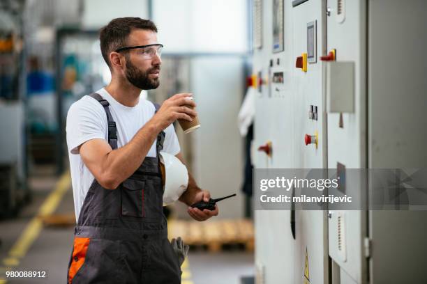 young worker in power substation - power supply unit stock pictures, royalty-free photos & images