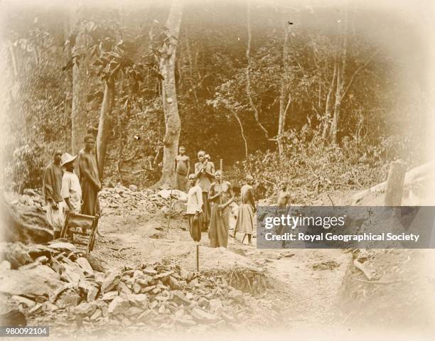 Blasting rocks to make the Nsendwe Road, Democratic Republic of the Congo, 1903.