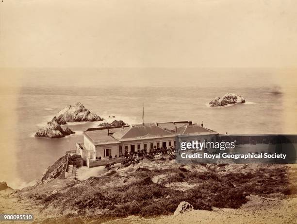 Cliff House and Seal Rock - near Farallons Islands, This photograph shows the view over 'Cliff House' to some rocky islets beyond. Horse-drawn...