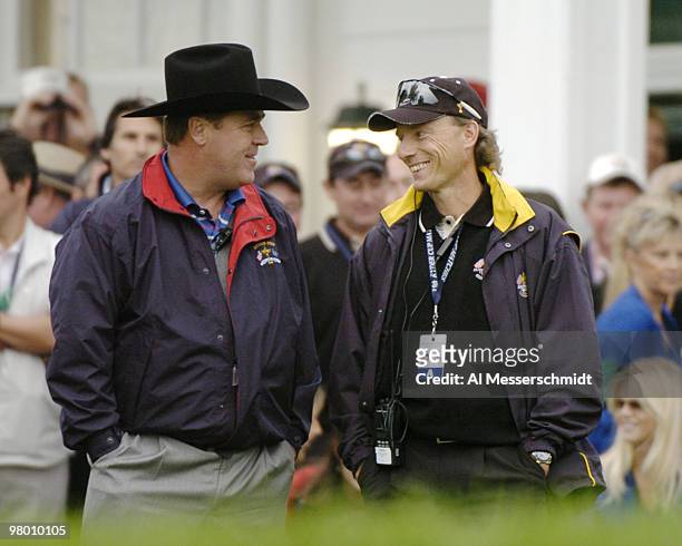 Captains Hal Sutton and Bernhard Langer watch their four-ball teams tee off during the 2004 Ryder Cup in Detroit, Michigan, September 17, 2004.