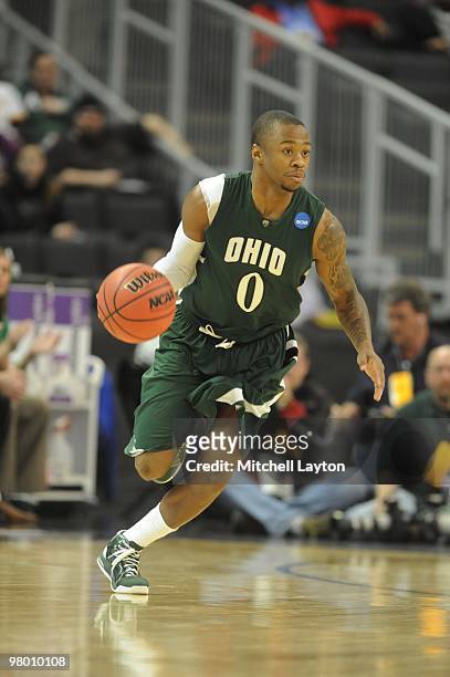 Armon Bassett of the Ohio University Bobcats dribbles up court during the first round of NCAA Men's Basketball Championship against the Georgetown...