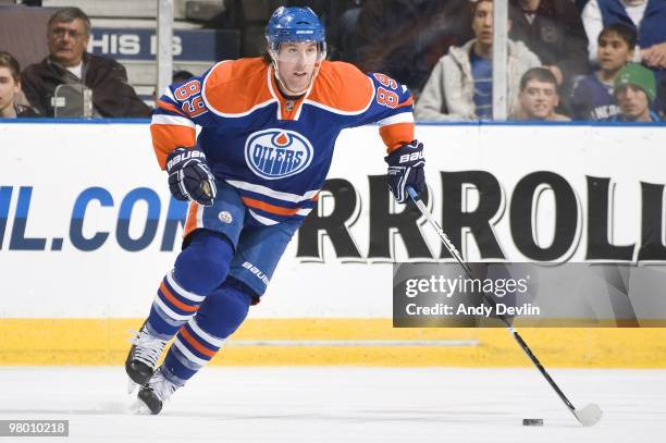 Sam Gagner of the Edmonton Oilers carries the puck against the Vancouver Canucks at Rexall Place on March 23, 2010 in Edmonton, Alberta, Canada. The...