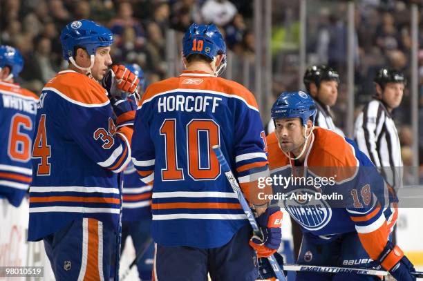 Edmonton Oilers veterans Fernando Pisani, Shawn Horcoff and Ethan Moreau of the Edmonton Oilers chat during a break against the Vancouver Canucks at...