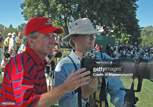 Tour commissioner Tim Finchem watches competition through a telephoto lens at the 2004 Ryder Cup in Detroit, Michigan.