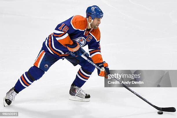 Ethan Moreau of the Edmonton Oilers carries the puck against the Vancouver Canucks at Rexall Place on March 23, 2010 in Edmonton, Alberta, Canada....