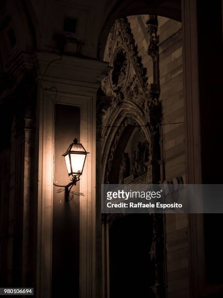 lighting lamp in saint januarius cathedral, naples, italy - raffaele esposito stock-fotos und bilder