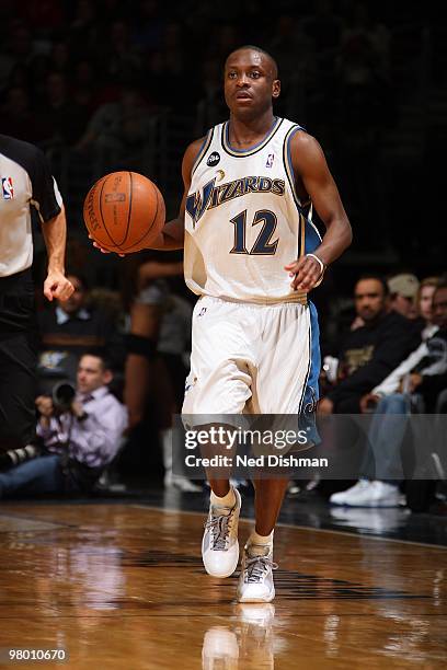 Earl Boykins of the Washington Wizards brings the ball upcourt against the Milwaukee Bucks during the game on March 5, 2010 at the Verizon Center in...