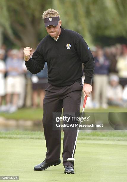Darren Clarke drops a winning putt during the afternoon foursome competition at the 2004 Ryder Cup in Detroit, Michigan, September 17, 2004.