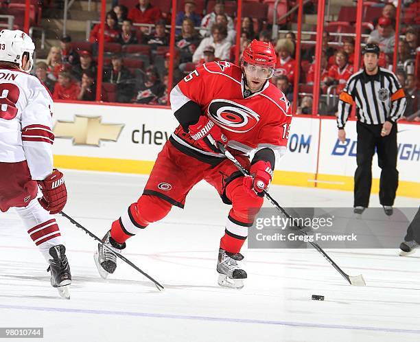 Tuomo Ruutu of the Carolina Hurricanes controls the puck during a NHL game against the Phoenix Coyotes on March 13, 2010 at RBC Center in Raleigh,...