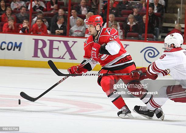 Chad LaRose of the Carolina Hurricanes skates with the puck during a NHL game against the Phoenix Coyotes on March 13, 2010 at RBC Center in Raleigh,...