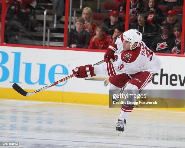 Keith Yandle of the Phoenix Coyotes shoots the puck during a NHL game against the Carolina Hurricanes on March 13, 2010 at RBC Center in Raleigh,...