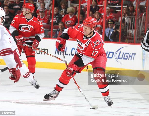 Rod Brind'Amour of the Carolina Hurricanes looks to pass the puck during a NHL game against the Phoenix Coyotes on March 13, 2010 at RBC Center in...