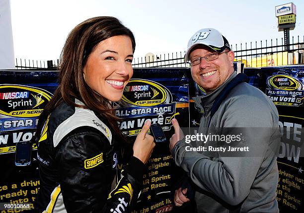 Miss Sprint Monica Palumbo poses with NASCAR fan James Bryant of Clover, SC after he cast the first official fan vote for the Sprint All Star race...