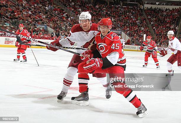 Alexandre Pichard of the Carolina Hurricanes skates for position against Shane Doan of the Phoenix Coyotes during a NHL game on March 13, 2010 at RBC...