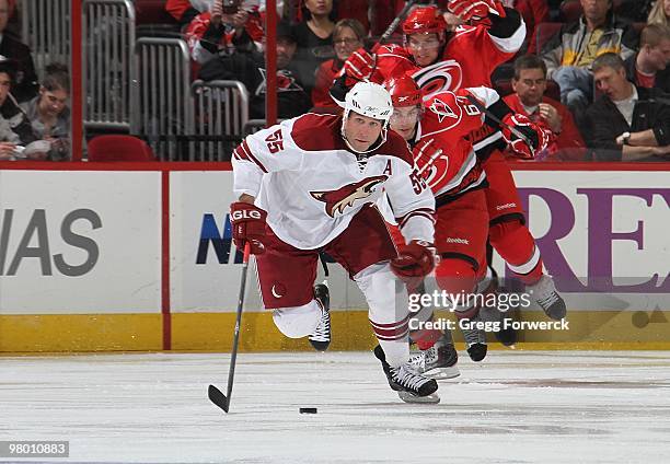 Ed Jovanovski of the Phoenix Coyotes skates with the puck during a NHL game against the Carolina Hurricanes on March 13, 2010 at RBC Center in...