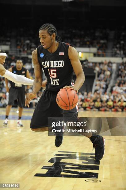 Kawhl Leonard of the San Diego State Aztecs dribbles the ball during the first round of NCAA Men's Basketball Championship against the Tennessee...