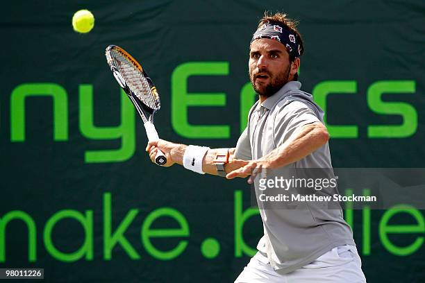 Arnaud Clement of France returns a shot against Guillermo Garcia-Lopez of Spain during day two of the 2010 Sony Ericsson Open at Crandon Park Tennis...