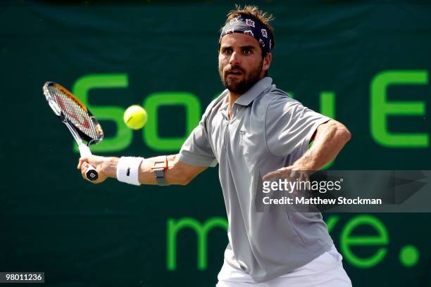 Arnaud Clement of France returns a shot against Guillermo Garcia-Lopez of Spain during day two of the 2010 Sony Ericsson Open at Crandon Park Tennis...