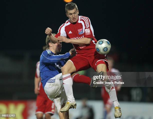 Christopher Lamprecht of Kiel and Tobias Schweinsteiger of Unterhaching compete for the ball during the 3. Liga match between Holstein Kiel v SpVgg...