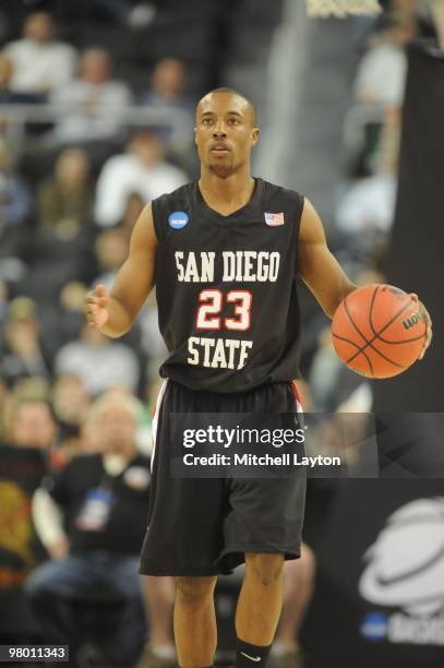 Gay of the San Diego State Aztecs dribbles up court during the first round of NCAA Men's Basketball Championship against the Tennessee Volunteers on...