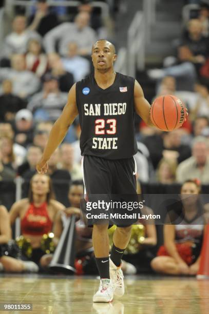 Gay of the San Diego State Aztecs dribbles up court during the first round of NCAA Men's Basketball Championship against the Tennessee Volunteers on...
