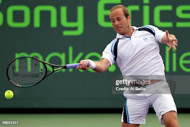 Olivier Rochus of Germany returns a shot against Richard Gasquet of France during day two of the 2010 Sony Ericsson Open at Crandon Park Tennis...