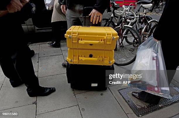 Material gathered by police officers and investigators from the Serious Fraud Office is pictured outside the London office of French engineering...