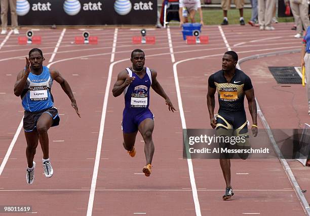 World record holder Justin Gatlin checks the competition and easily wins a qualifying heat in the men's 100-meter dash in 10.02 seconds June 23 at...