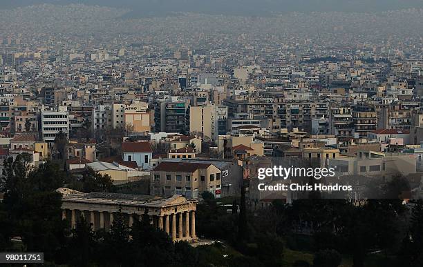 Central Athens, featuring ancient ruins and modern housing, is seen in the early-morning hours on March 24, 2010 in Athens, Greece. Higher prosperity...