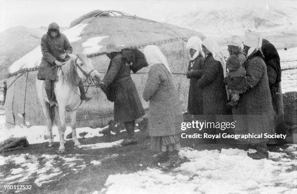 Preparing for travel across the Sarikol plateau, The Sarikol plateau is located in the Pamir mountains. The original caption of this photograph is...