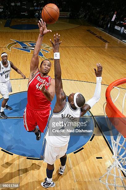 Chuck Hayes of the Houston Rockets puts up a shot against Andray Blatche of the Washington Wizards during the game on March 9, 2010 at the Verizon...