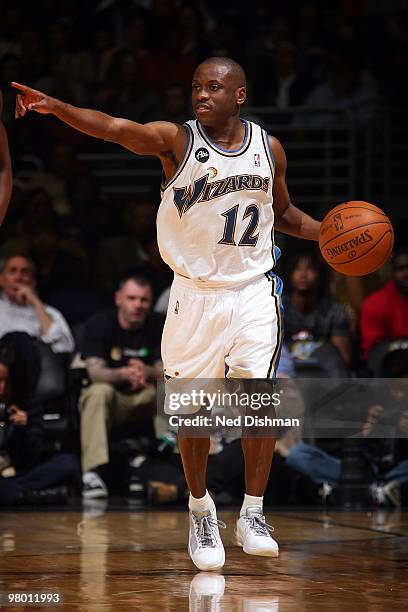 Earl Boykins of the Washington Wizards brings the ball upcourt against the Houston Rockets during the game on March 9, 2010 at the Verizon Center in...