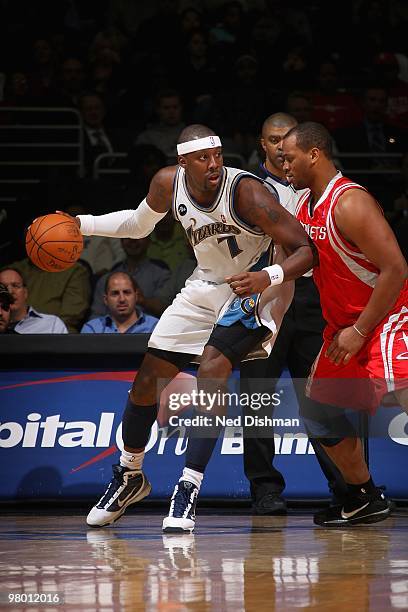 Andray Blatche of the Washington Wizards posts up against Chuck Hayes of the Houston Rockets during the game on March 9, 2010 at the Verizon Center...