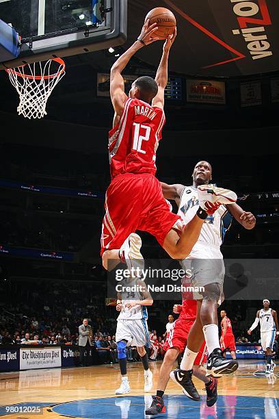 Kevin Martin of the Houston Rockets goes to the basket against Al Thornton of the Washington Wizards during the game on March 9, 2010 at the Verizon...