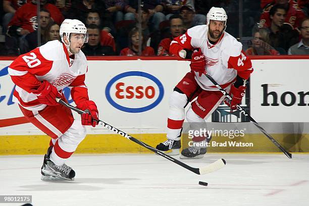 Drew Miller and Todd Bertuzzi of the Detroit Red Wings skates against the Calgary Flames on March 15, 2010 at Pengrowth Saddledome in Calgary,...