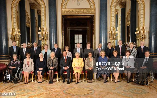 Queen Elizabeth II and Prince Philip, Duke of Edinburgh pose with Civil Service Commissioners before a reception for Civil Service Commissioners at...